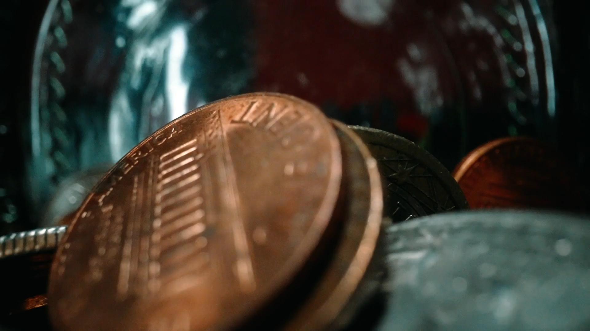 Close-up of copper pennies in a jar
